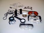 Exemplos de recursos ópticos: diferentes tipos de lupas, telescópios e óculos com filtro.